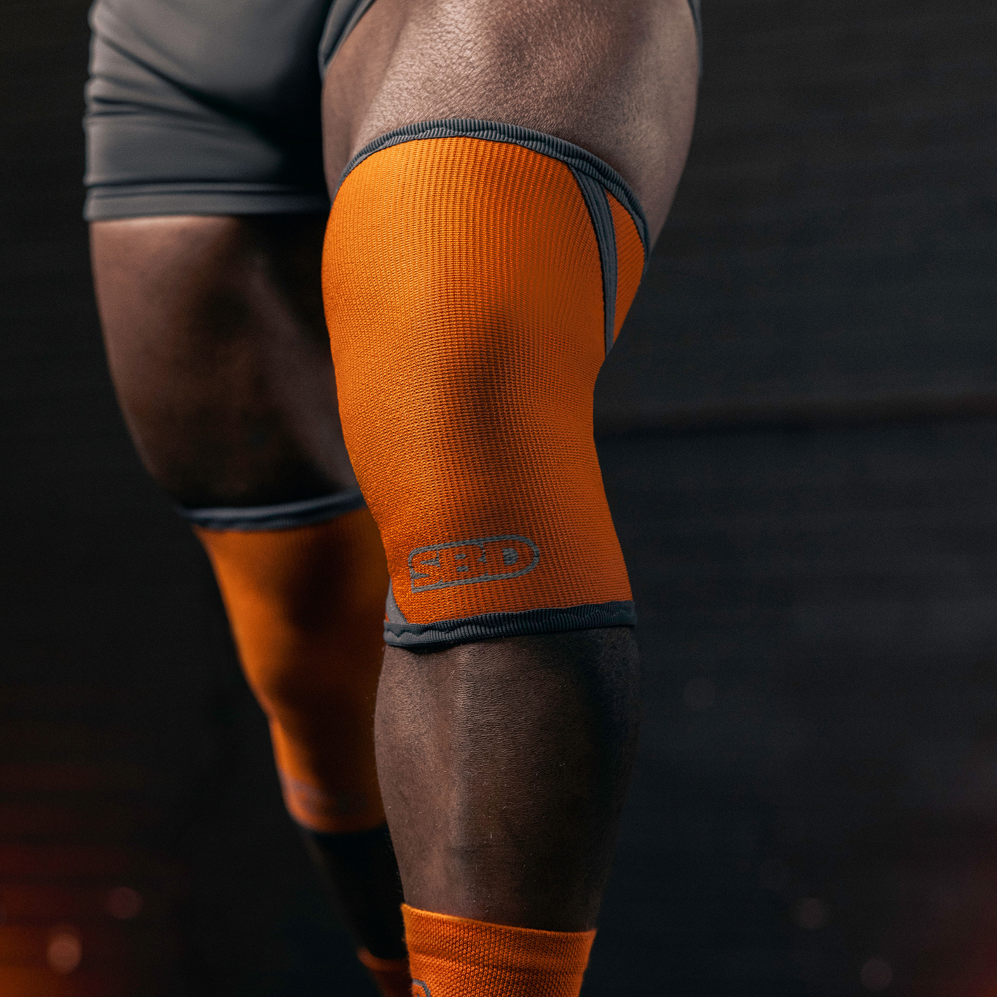 orange/grey knee sleeves