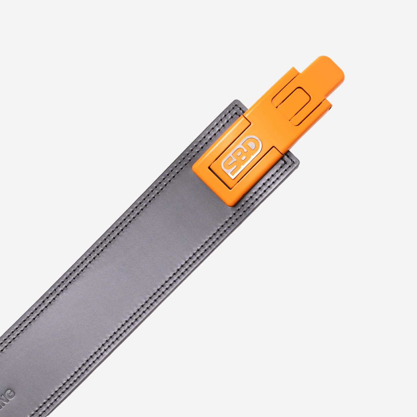 orange buckle on grey belt